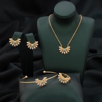 طقم أطفال باللونين الذهبي والسماوي