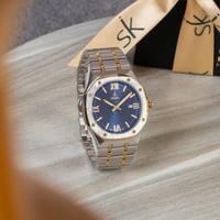 ساعة ستيل باللون الذهبي والفضي