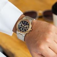 ساعة ستيل باللون الذهبي و الفضي ميناء كحلي