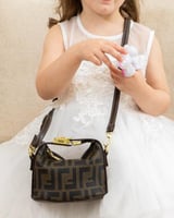 صُممت لتكون قطعة مكملة لطفلتك بحجم ميني