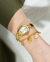 ساعة بتصميم مبتكر باللون الذهبي ميناء أبيض