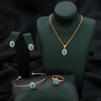 طقم أطفال باللونين الذهبي والسماوي