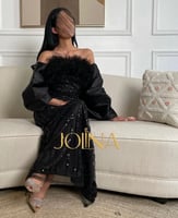 فستان اسود ريش