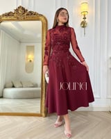 طقم عنابي مطرز باكمام طويلة