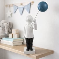 تحفة ديكورية صغيرة بتصميم فني راقي، تُجسّد هيئة بش...