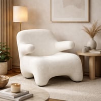 كرسي مريح بتصميم عصري ومنحنيات ناعمة، مكسو بقماش ف...