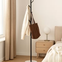 علاقة ملابس أرضية بتصميم عصري بسيط باللون الأسود