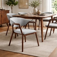 كرسي أنيق بتنجيد رمادي وإطار خشبي.