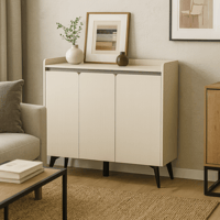 خزانة عصرية بلون كريمي وأرجل سوداء أنيقة.