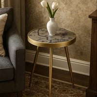 طاولة شاي دائرية أنيقة بتصميم عصري وأرجل متينة.