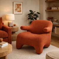 كرسي مريح بتصميم عصري ومنحنيات ناعمة، مكسو بقماش ف...