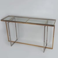 كونسول استيل من لونين الذهبي والفضي وبسطح زجاجي