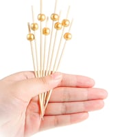 اعواد حلا خشب بالؤلؤ ذهبي 50 حبة