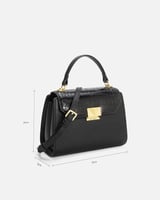 شنطة نسائية من الجلد بلون أسود