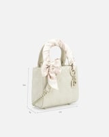 شنطة نسائية بجلد بارز بلون بيج