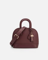 شنطة نسائية من الجلد بلون عودي