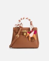 شنطة نسائية من الجلد بلون بني