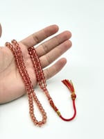 سبحة زعفران عسلي 99 خرزة كركوشة