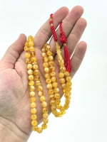 سبحة مستكة شبيه الكهرمان 99 خرزة