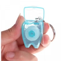 ميدالية بشكل السن داخله خيط أسنان