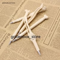 قلم على شكل عظام مع كرت