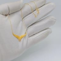 عقد جناح الصقر ذهب عيار 21