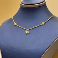 عقد تصميم عالمي ذهب عيار 21