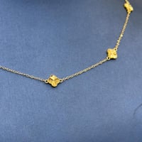 عقد تصميم عالمي ذهب عيار 21