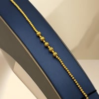 اسوارة كرات ذهب عيار 21