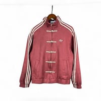 جاكت اديداس نسخة السنة الصينية الجديدة