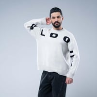 سويتر شتوي أوفرسايز بياقة مستديرة وتصميم حروف بارز...