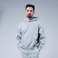 هودي سادة أوفرسايز بقبعة وجيب كانغارو واسع وحافة م...