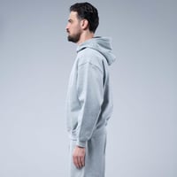 هودي سادة أوفرسايز بقبعة وجيب كانغارو واسع وحافة م...