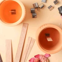 «قاعدة حديد لفتيل الخشب»