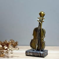 ديكور كمنجة سيراميك ذهبي انتيك مع كتاب