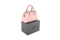 حقيبة يد من Coach باللون الوردي الفاتح