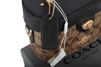 شنطة كروس كاي من قماش سيغنتشر من كوتش