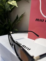 نظارة miu miu إطار أسود - عدسة بني