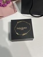 إسوارة سان لوران ذهبي