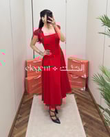 فستان سهرة أحمر للمحجبات بأكمام فاخرة وقصة واسعة
