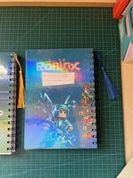 دفتر روبلوكس مع اضافة الاسم