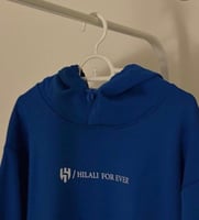 بلوفر الهلال طباعة ALHILAL بلون ابيض على الخلف كام...