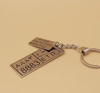 ميدالية مفتاح لوحة سيارة مع عبارة