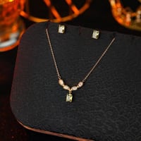 تعليقة مع حلق زركون ذهبي فص زيتي من فايلت