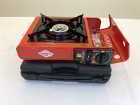 موقد رحلات مع شنطه صناعه صينيه يعمل على علب الغاز...