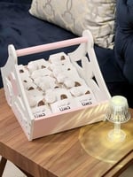 توزيعات مواليد جلد مع بروش وكسرة عود (وردي)