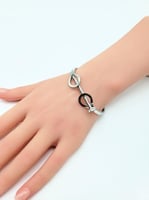 سوارة وخاتم كارتير تصميم عصري ذهبي وفضي - مستوحاة