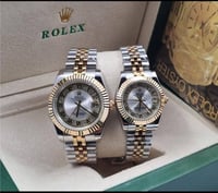 طقم ساعة رولكس رجالي ونسائي فضي وذهبي بميناء فصوص...
