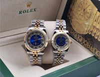 طقم ساعة رولكس رجالي ونسائي فضي وذهبي بميناء فصوص...