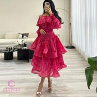 فستان سهرة وردي مموج بطبقات